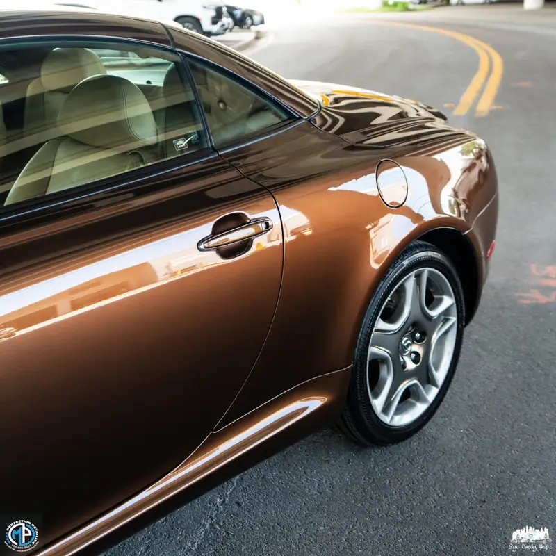 Bronze Bentley with a mirror finish after a luxury detail by Maxx Perfection