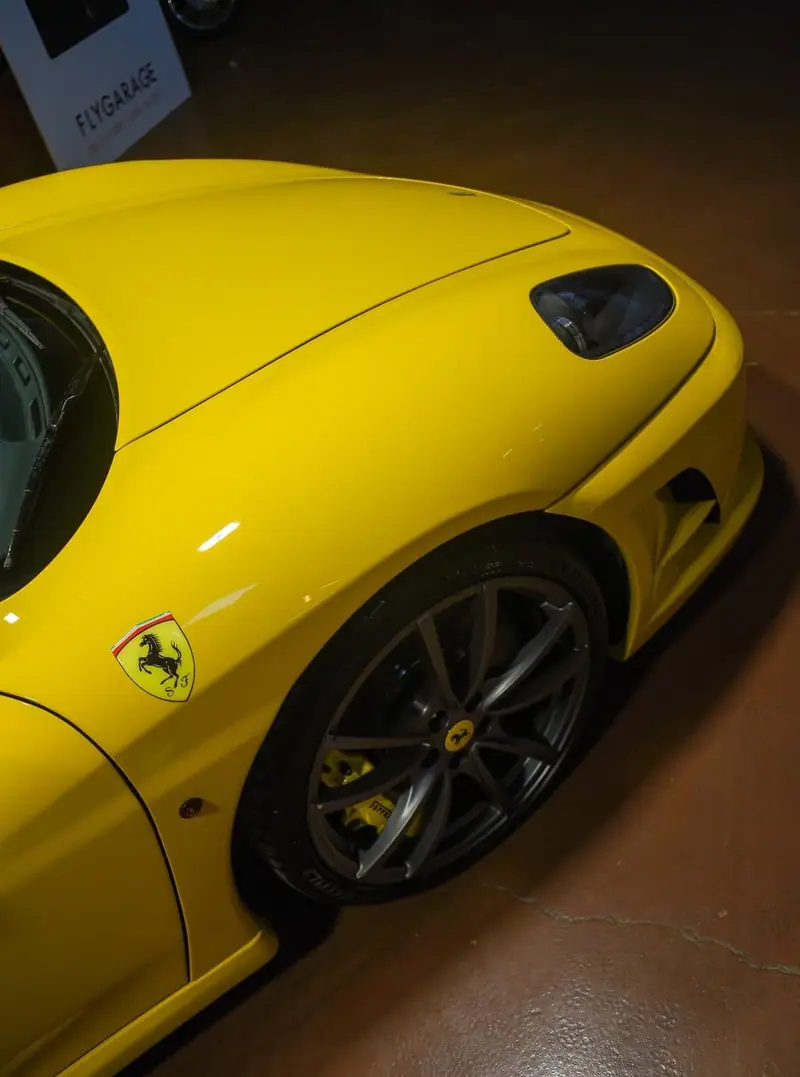 Yellow Ferrari front fender and wheel after paint correction, detailed by Maxx Perfection in Jacksonville