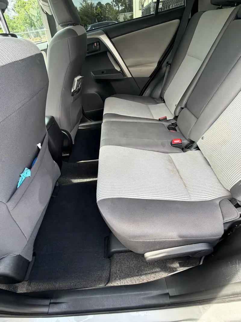 Rear seats of a Toyota RAV4 after dog hair removal during an interior detail