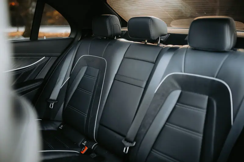 Spotless black leather rear bench after an interior detail