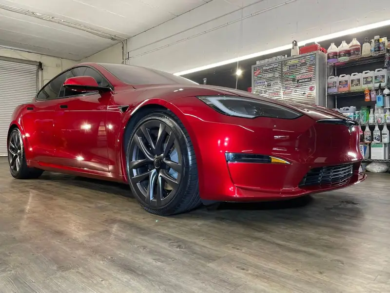 Red Tesla with a fresh ceramic coating by Maxx Perfection Detailing, Jacksonville FL
