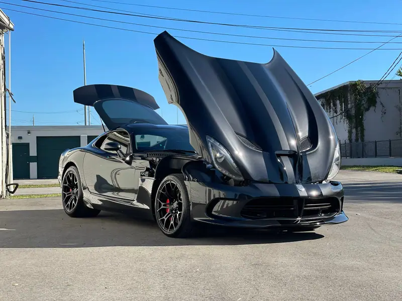 Black Dodge Viper with the hood raised after a detail by Maxx Perfection Detailing